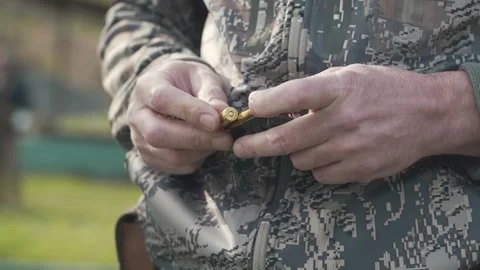 Bullets are shoved into the clip close-up Stock Footage 243486330