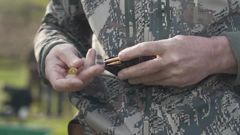 Bullets are shoved into the clip close-up Stock Footage 243486558
