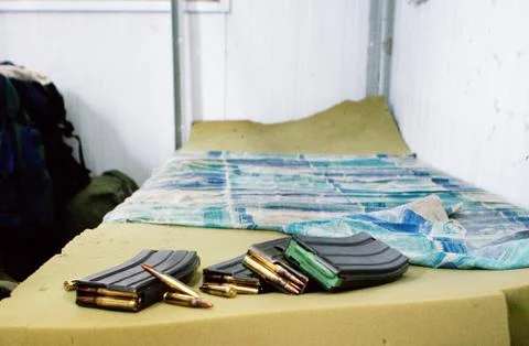 Bullets on a bed Stock Photos