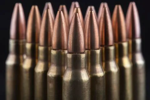 Bullets on black Stock Photos