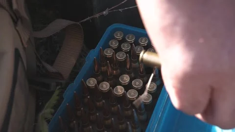 Bullets in a box for a sniper rifle Stock Footage 243486470