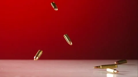 Bullets falling and bouncing creating dynamic motion scene Stock Footage 327051644