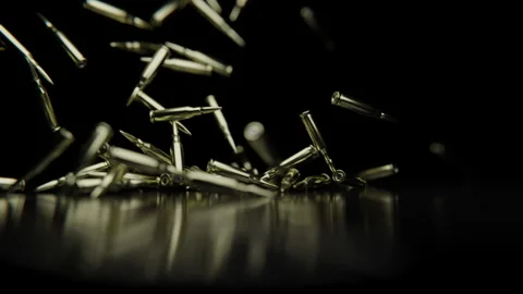 Bullets falling down on a reflective surface Stock Footage 253628971