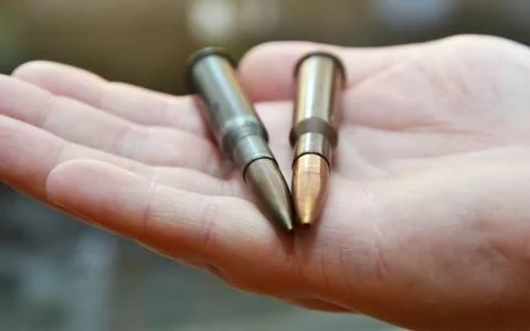 Bullets in hand Stock Photos