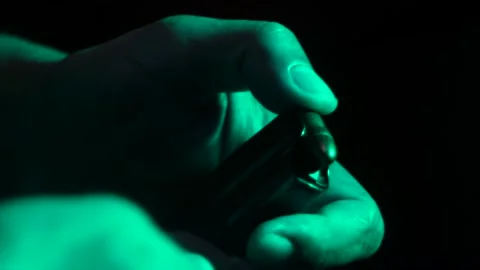 Bullets. Hands on a gun. Stock Footage 146200930