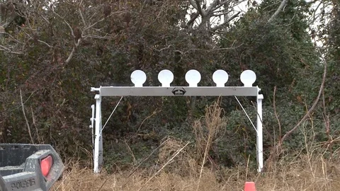 Bullets hitting targets  Video stock 76940134