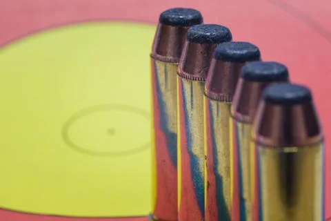 Bullets lined up on a target face Stock Photos