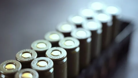 Bullets in packaging on the table. Stock Footage 142627052
