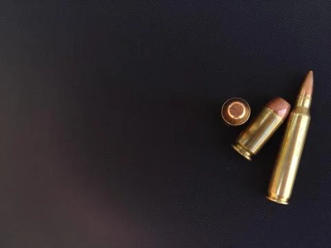 Bullets for rifle handgun pistol firearm closeup Stock Photos