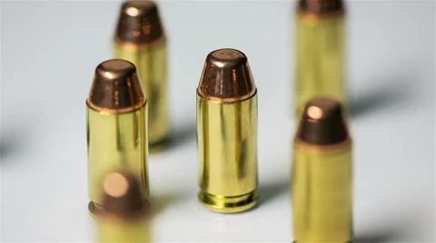 Bullets Rotate on Table Loop Stock Footage 57753213