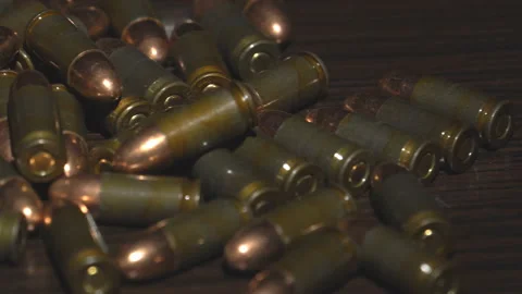 Bullets scattered on the table Stock Footage 96715897
