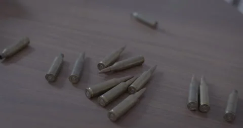 Bullets spread over a table Stock Footage 154482734