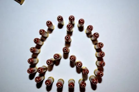 Bullets standing on white background creates peace sign Stock Photos