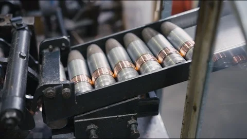 Bullets transported on automatic production line in workshop Stock Footage 118768936