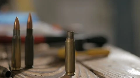 Bullets on wooden background Stock Footage 102527191