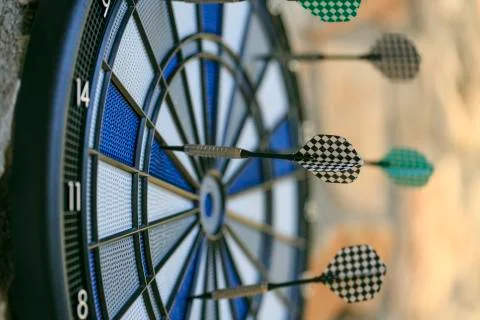 Bullseye on a wall with some darts Stock Photos