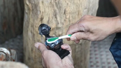 Bulul Carving Cleaning Stock Footage 126811267