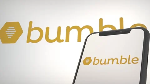 Bumble app logo in mobile display screen and background editorial Stock Footage 255171537