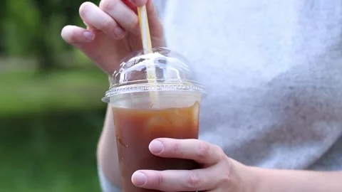 Bumble coffee. Coffee with juice in a disposable plastic cup 7 00001747 Stock Footage 312072005