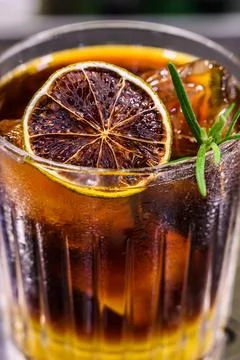 Bumble coffee with ice on a stone background. Espresso, layered passion fruit Stock Photos