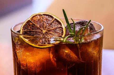 Bumble coffee with ice on a stone background. Espresso, layered passion fruit Stock Photos