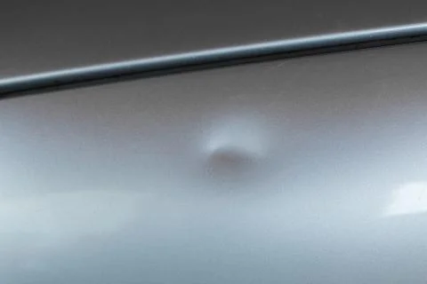 Bump on car with silver paint Stock Photos