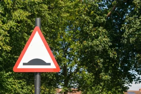 Bump warning traffic sign Stock Photos