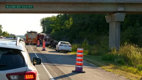 Bumper-to-Bumper Traffic Jam Under Bridge During Rush Hour with Merging Vehicles Stock Photos