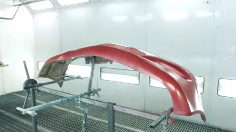 Bumper of car painted red on special stand in auto service Stock Footage 166576457