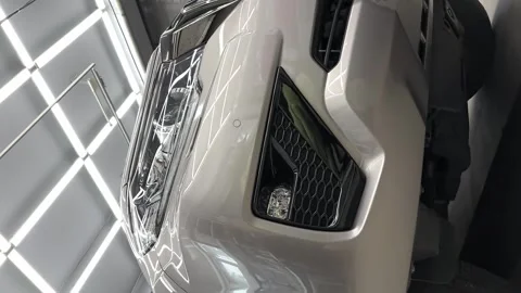 Bumper, lights, hood of Grey mirror premium car in the detaling center after Stock Footage 243628643
