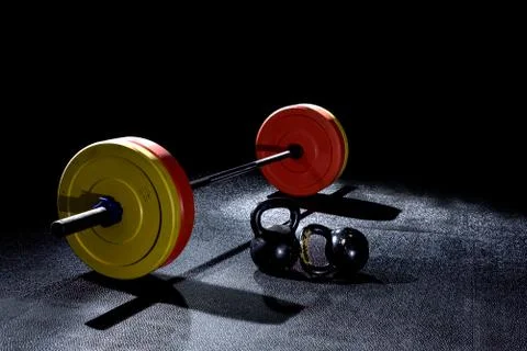 Bumper plates in gym with dramatic lighting Stock Photos