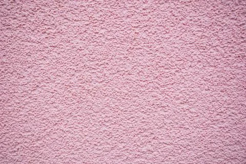 Bumpy and grainy pink wall for backgrounds and texture Stock Photos