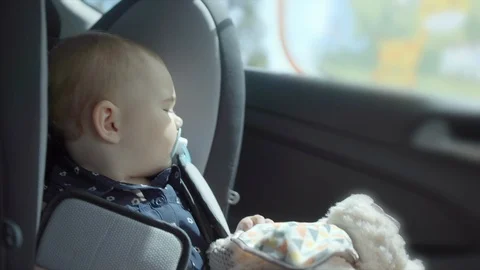 Bumpy car ride for Toddler in rear car safety seat. Stock Footage 106564970