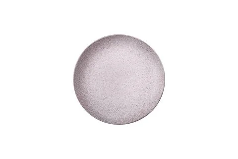 Bumpy empty ceramic plate on a textured concrete background 写真素材