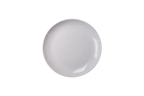 Bumpy empty ceramic plate on a textured concrete background 写真素材