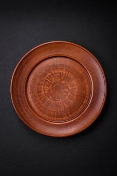 Bumpy empty ceramic plate on a textured concrete background Bumpy empty ce... Stock Photos