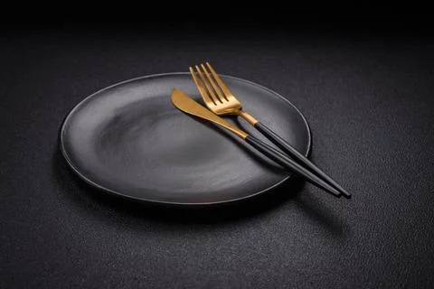 Bumpy empty ceramic plate on a textured concrete background Bumpy empty ce... Stock Photos