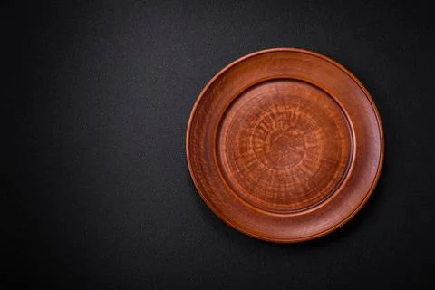 Bumpy empty ceramic plate on a textured concrete background Bumpy empty ce... 写真素材