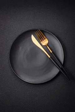 Bumpy empty ceramic plate on a textured concrete background Bumpy empty ce... Stock Photos