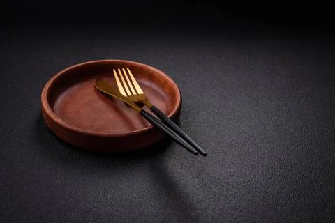 Bumpy empty ceramic plate on a textured concrete background Bumpy empty ce... 写真素材