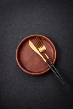 Bumpy empty ceramic plate on a textured concrete background Bumpy empty ce... 写真素材