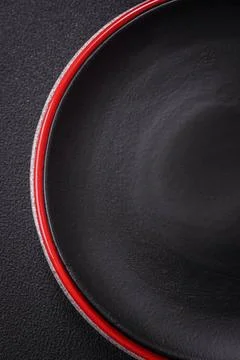 Bumpy empty ceramic plate on a textured concrete background Bumpy empty ce... 写真素材