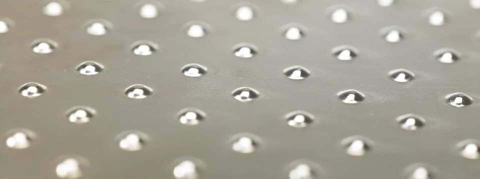 Bumpy metal surface close up Stock Photos