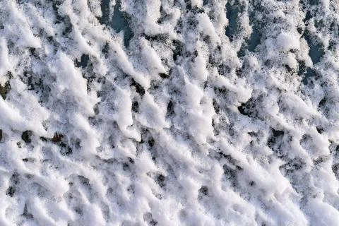 Bumpy texture of white snow on glass Stock Photos