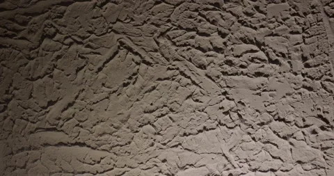 Bumpy wall texture spotlight shadow effect Video stock 327291575