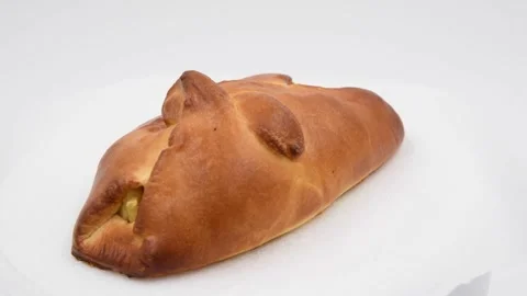 Bun with apple on gray background Stock Footage 277151464