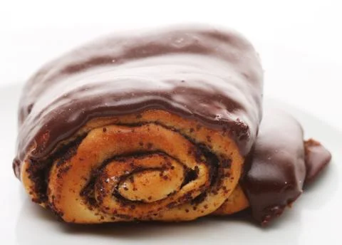 Bun with chocolate glaze Stock Photos