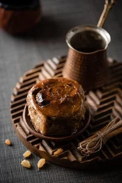 Bun with coffee dark background Stock Photos
