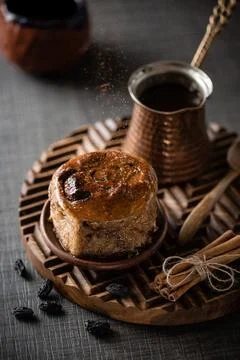 Bun with coffee dark background Stock Photos