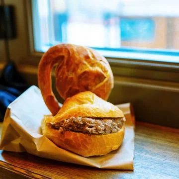 Bun with goose stew inside Stock Photos
